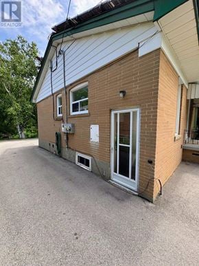 Halton Hills (Georgetown) apartment for rent - A small brick house with a white door and windows.