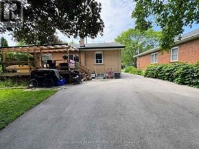 Halton Hills (Georgetown) apartment for rent - A residential street with a house and a truck parked in front.
