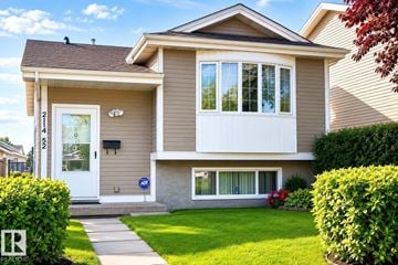 Edmonton apartment for rent - A two-story house with a white door and windows.