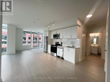 Toronto (Humber Heights) condo for rent - A modern kitchen with white cabinets and stainless steel appliances.