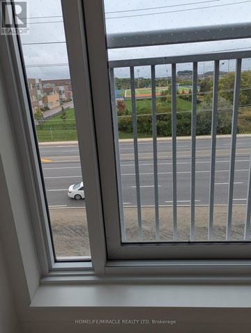 Brampton (Northwest Brampton) condo for rent - A white car is parked on the side of the road.