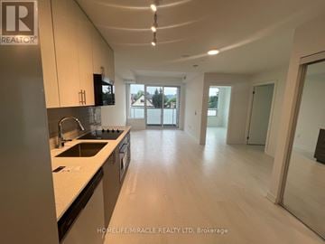Hamilton (Kirkendall) condo for rent - A modern kitchen with a sink, stove, and cabinets.