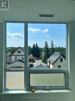 Hamilton (Kirkendall) condo for rent - A window with a view of a residential area.