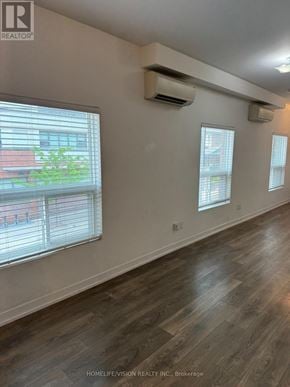 Toronto (Church-Yonge Corridor) apartment for rent - A room with a window and a wall-mounted air conditioner.