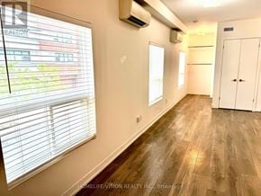Toronto (Church-Yonge Corridor) apartment for rent - A room with wooden flooring and a window with blinds.