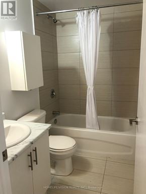 Toronto (Church-Yonge Corridor) apartment for rent - A white bathroom with a toilet, sink, and bathtub.