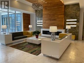 Vaughan (Beverley Glen) condo for rent - A reception area with a white reception desk and a large window.