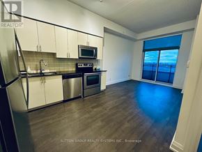 Vaughan (Beverley Glen) condo for rent - A kitchen with white cabinets and stainless steel appliances.