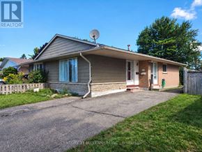 Orangeville apartment for rent - A house with a grey roof and a satellite dish on the roof.