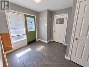 Orangeville apartment for rent - A room with a green door and a white door.