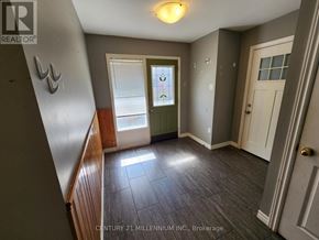 Orangeville apartment for rent - A room with a door, window, and a light on the ceiling.