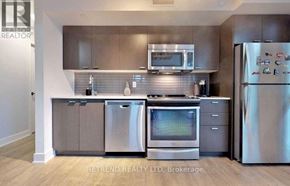 Toronto (Lansing-Westgate) condo for rent - A kitchen with a refrigerator, microwave, and dishwasher.