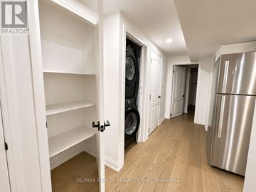 Brampton (Heart Lake West) apartment for rent - A white kitchen with a refrigerator and a washing machine.