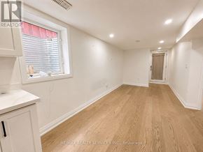 Brampton (Heart Lake West) apartment for rent - A room with wooden flooring and white walls.