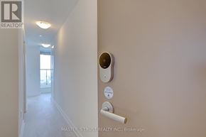 Toronto (Banbury-Don Mills) condo for rent - A brokerage sign is on the wall of a hallway.