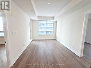 Markham (Unionville) condo for rent - A room with wooden floors and white walls.