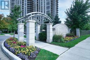 Toronto (West Humber-Clairville) condo for rent - A realtor sign is in front of a gate.