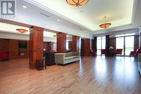 Toronto (West Humber-Clairville) condo for rent - A spacious living room with wooden floors and furniture.