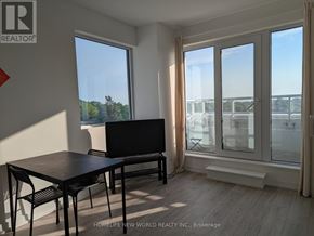 Toronto (Humewood-Cedarvale) condo for rent - A room with a table and chairs in front of a large window.