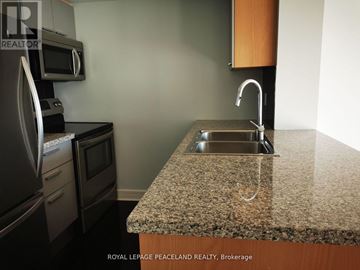Toronto (Willowdale East) condo for rent - A kitchen with granite countertops and stainless steel appliances.
