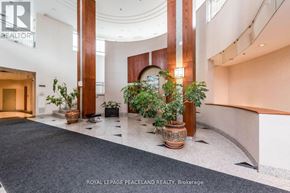 Toronto (Willowdale East) condo for rent - A hallway with a plant in a pot and a plant in a basket.