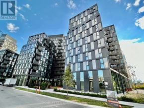 Toronto (Clanton Park) condo for rent - A modern building with glass windows and a sign that reads "HOMELIFE NEW WORLD REAL ESTATE Brokerage".