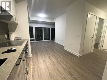 Toronto (Banbury-Don Mills) condo for rent - A kitchen with a counter top and a window with blinds.