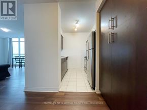 Toronto (Bendale) condo for rent - A kitchen with a refrigerator, sink, and cabinets.