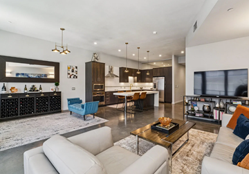 Boise apartment for rent - A modern living room with a white couch and a coffee table.