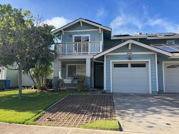 Waianae apartment for rent - A blue house with a white garage door.