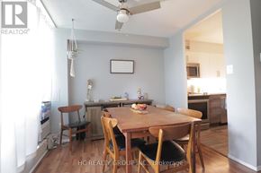 Toronto (Victoria Village) condo for rent - A dining room with a wooden table and chairs.
