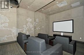 Toronto (Bay Street Corridor) condo for rent - A home theater room with a large screen and comfortable seating.