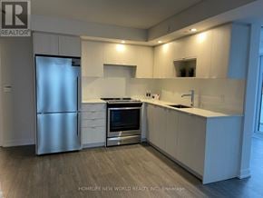 Toronto (Agincourt South-Malvern West) condo for rent - A modern kitchen with white cabinets and stainless steel appliances.