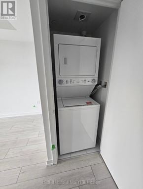 Toronto (Yorkdale-Glen Park) condo for rent - A white dryer is in a small alcove in a room.