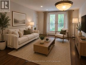 Toronto (Junction Area) apartment for rent - A well-lit, modern living room with a white sofa, a wooden coffee table, and a large window with curtains.