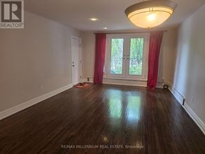 Toronto (Junction Area) apartment for rent - A room with a window and a fireplace in it.