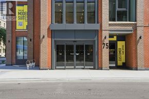 Hamilton (Durand) condo for rent - A building with a sign that says "Townhomes" on it.