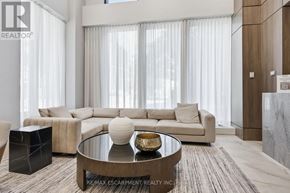 Hamilton (Durand) condo for rent - A modern living room with a large sectional sofa and a coffee table.