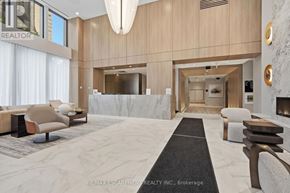 Hamilton (Durand) condo for rent - A spacious living room with a marble floor and a long black carpet leading to a hallway.