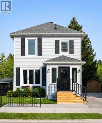 Brampton (Brampton West) apartment for rent - A two-story house with a black front door and a black metal fence.