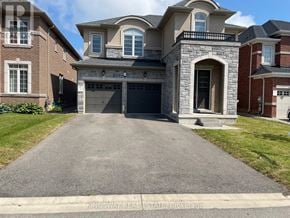Hamilton (Meadowlands) apartment for rent - A large, two-story house with a garage is shown.