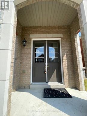 Hamilton (Meadowlands) apartment for rent - A house entrance with a grey door and a black mat.