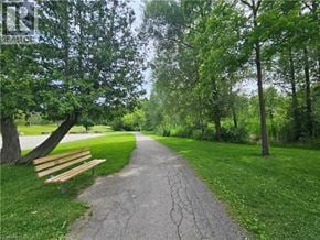 Cambridge townhouse for rent - A park pathway with a bench on the side.