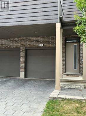 London South (South U) townhouse for rent - A house numbered 37 has a grey garage door.
