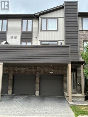 London South (South U) townhouse for rent - A modern house with a grey garage door.
