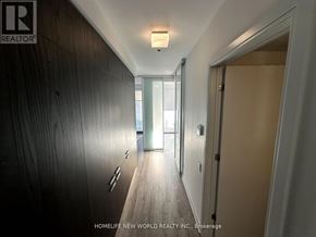 Toronto (Church-Yonge Corridor) condo for rent - A hallway with a wooden floor and a light on the ceiling.
