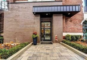 Toronto (The Beaches) condo for rent - The entrance to a building with a sign that reads "Belgrave Avenue".