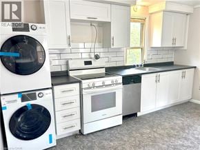 Brantford apartment for rent - A laundry room with a washer and dryer.