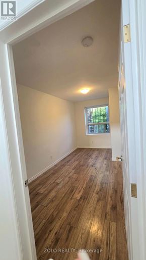 Toronto (O'connor-Parkview) apartment for rent - A room with wooden floors and a window.