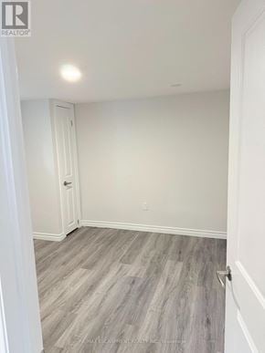 Barrie (Wellington) apartment for rent - A room with a grey floor and white walls.